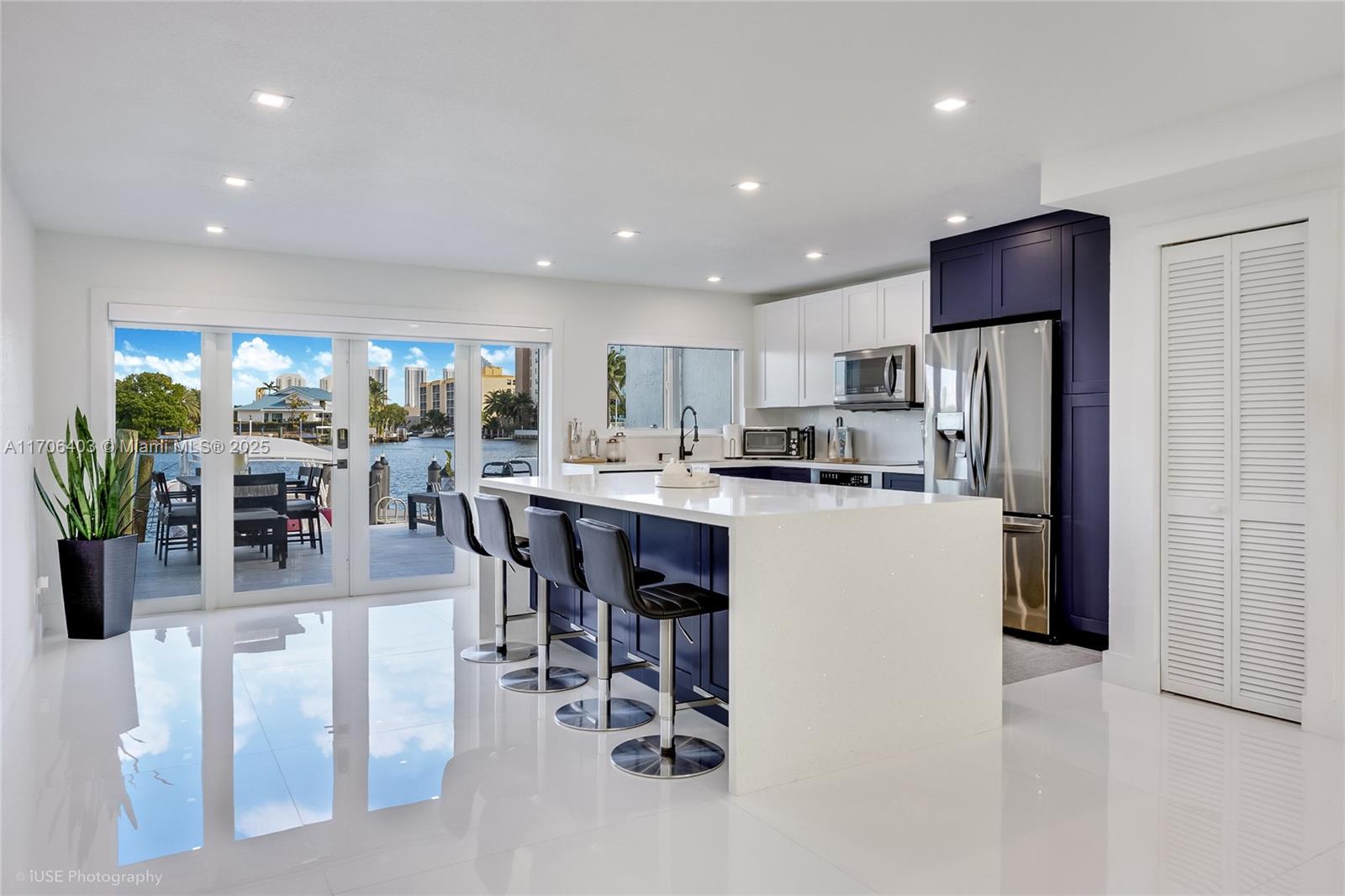 Breath taking water views from this modern beach house that has been completely renovated with no expense spared. Includes a deeded perpendicular dock space that fits a boat up to 40 feet and sits on Maule Lake with direct ocean access and no fixed bridges. This modern home includes a split floor plan with large 48X48 Italian Porcelain floors throughout the whole house, black stainless steel appliances, Impact windows and doors, a laundry area conveniently located upstairs, and a custom dream walk-in master closet. New roof is in the process of being completed and offering the option to purchase fully furnished. Only minutes away from Haulover, the beach, restaurants and shopping. Located on a dead end street which provides peace and quiet.