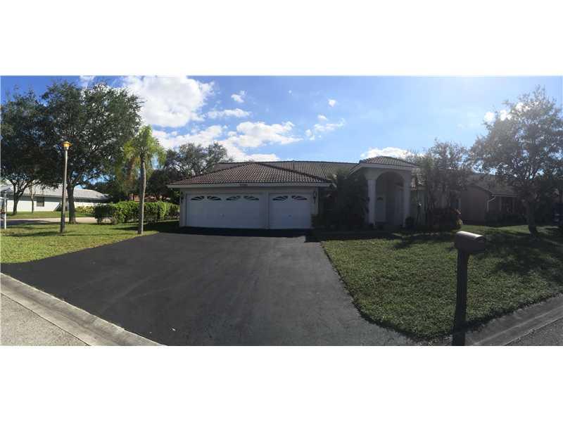 Fantastic 4/2.5, 3 car garage ranch home located on this oversized corner lot in north springs. Fully Renovated! A true must see with southwestern tile throughout, wood floor in all bedrooms, remodeled kitchen overlooking large family room Walk out to sc reened patio featuring pool and covered area. Open floor plan, large spacious rooms, VAULTED CEILINGS in living room and master room. New Pump. New Paint. BRAND NEW SS APPLICANCES WILL BE PROVIDED BY SELLER BEFORE CLOSING. TOP "A" RATED SCHOOLS. NO HOA.
