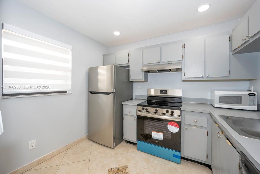 Photo of 10537 NW 11th St #202, Pembroke Pines, FL 33026 (MLS # A11966258)