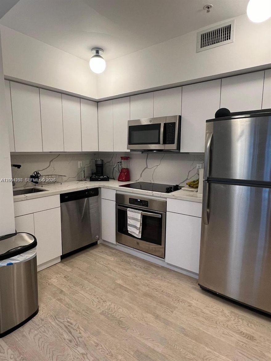 ABSOLUTELY MUST SEE! Beautifully renovated 1 bedroom unit with incredible light, gorgeous light, oak wood floors, Italian marble bathroom and a custom made kitchen. Elegantly decorated in a chic boho style. Few steps from South of Fifth and the beach.