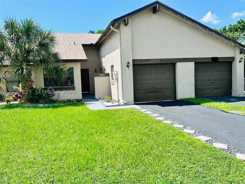 Photo of 8203 NW 100th Dr, Tamarac, FL 33321 (MLS # A12033239)