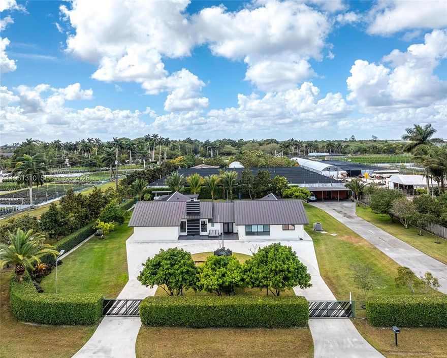 Tucked in Miami-Dade’s beloved Redland agricultural area, this estate offers the rare combination of space, privacy, and convenience! Set on nearly a full acre, the property creates a private tropical setting surrounded by 40 fruit trees and outdoor space designed for relaxation and entertaining.

Inside, the home offers over 4,000 sq ft of actual area with 6 bedrooms and 5.5 bathrooms, including 3 en-suite bedrooms, making the layout ideal for larger households, guests, or multi-generational living. The home features a main kitchen plus a separate butler’s kitchen, perfect for hosting gatherings or catering events, along with two laundry areas.

The backyard is the centerpiece, featuring an oversized approximately 1,500 sq ft heated saltwater pool & spa, creating a resort-style outdoor experience. A cabana bathroom, entertaining areas, and yard space make it ideal for gatherings or quiet evenings at home.

The fully fenced property provides space for boats, RVs, multiple vehicles, and recreational equipment, along with a 3-car carport with electrical.

Additional highlights include metal roof, impact windows & doors, quartz countertops, LED lighting throughout, working wood-burning fireplace, whole-house water softener, and irrigation system on well water.

Located in the Redlands without being too deep into the agricultural area, this property offers space, flexibility, and the lifestyle that makes this area sought after.
