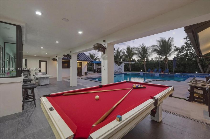 Open House: Sun. May 17 from 12-3pm! Tucked in Miami-Dade’s beloved Redland agricultural area, this estate offers the rare combination of space, privacy, and convenience! Set on nearly a full acre, the property creates a private tropical setting surrounded by 40 fruit trees and outdoor space designed for relaxation and entertaining.

Inside, the home offers over 4,000 sq ft of actual area with 6 bedrooms and 5.5 bathrooms, including 3 en-suite bedrooms, making the layout ideal for larger households, guests, or multi-generational living. The home features a main kitchen plus a separate butler’s kitchen, perfect for hosting gatherings or catering events, along with two laundry areas.

The backyard is the centerpiece, featuring an oversized approximately 1,500 sq ft heated saltwater pool & spa, creating a resort-style outdoor experience. A cabana bathroom, entertaining areas, and yard space make it ideal for gatherings or quiet evenings at home.

The fully fenced property provides space for boats, RVs, multiple vehicles, and recreational equipment, along with a 3-car carport with electrical.

Additional highlights include metal roof, impact windows & doors, quartz countertops, LED lighting throughout, working wood-burning fireplace, whole-house water softener, and irrigation system on well water.

Located in the Redlands without being too deep into the agricultural area, this property offers space, flexibility, and the lifestyle that makes this area sought after.