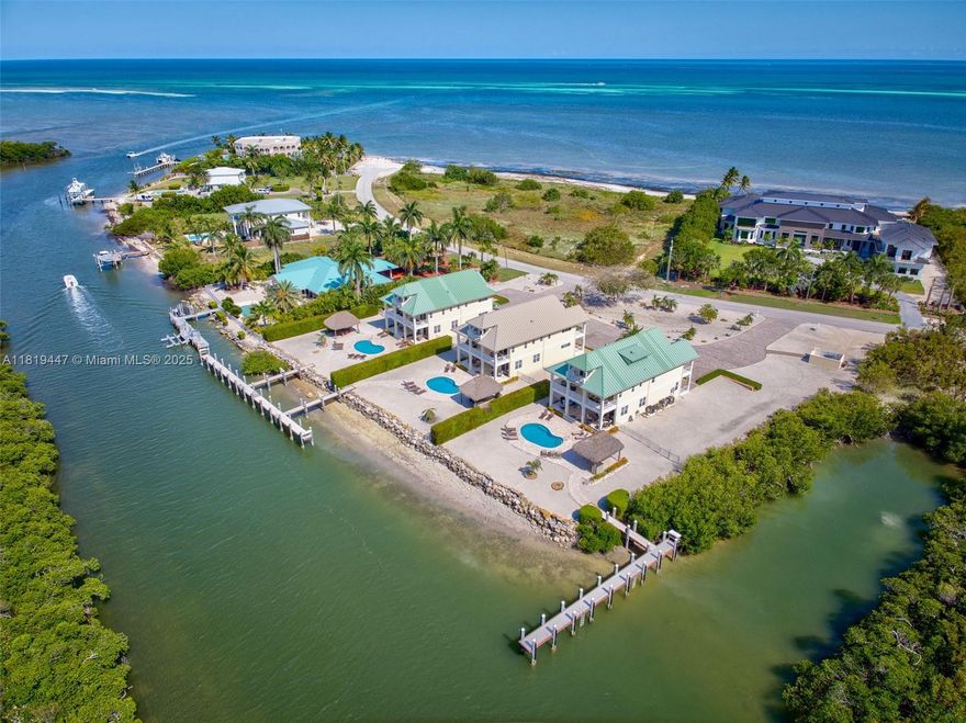 Welcome to an unparalleled collection of THREE designer residences on one of the most exclusive waterfront parcels in the Florida Keys. Located just steps from Coco Plum Beach and the Atlantic Ocean, this rare investment opportunity is the ultimate blend of luxury, lifestyle, and income potential. Each of the three homes spans off 4,066 square feet and features 6 spacious bedrooms and 6.5 bathrooms with custom millwork and designer fixtures. The interiors are professionally furnished with a curated blend of comfort and elegance, complemented by expansive ceiling heights, open-concept living areas and balconies throughout. Designed with privacy in mind, each home includes its own private pool, tiki hut, and a dock offering deepwater and direct ocean access.