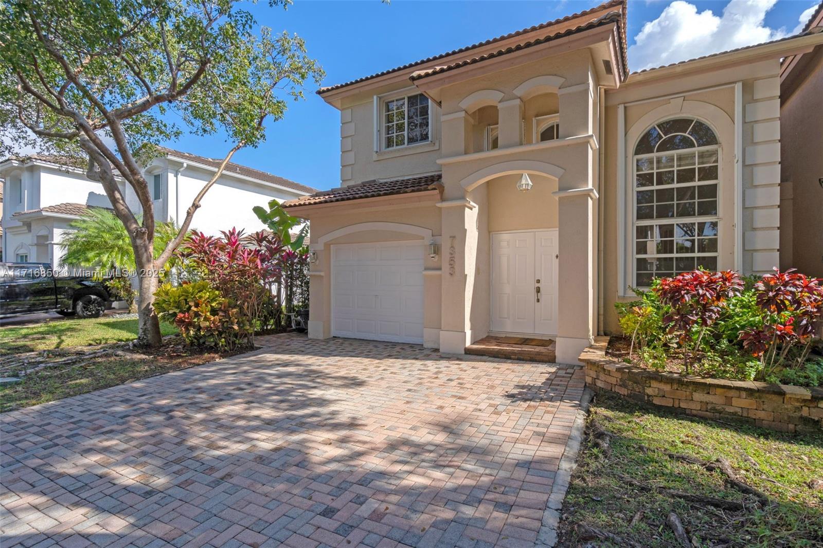 Discover this stunning two-story Martinique model in the prestigious Doral Isles community. Featuring 3 bedrooms, 2.5 bathrooms, and 1 car garage, this home is flooded with natural light and showcases ceramic tile flooring on the first floor and wood flooring on the second. The open kitchen seamlessly connects to the living, TV, and dining areas, leading to a private patio with a partially covered terrace. Enjoy resort-style amenities, including sports courts, two pools, a sandy lakeside beach, a gym, and a clubhouse. Live the exclusive, active lifestyle you deserve schedule your tour today! PLEASE ENTER THRROUGH MAIN ENTRANCE ON 58TH ST