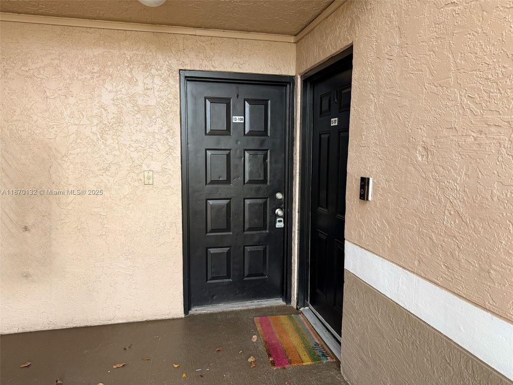 Photo of 8781 Wiles Rd #108, Coral Springs, FL 33067 (MLS # A11870132)