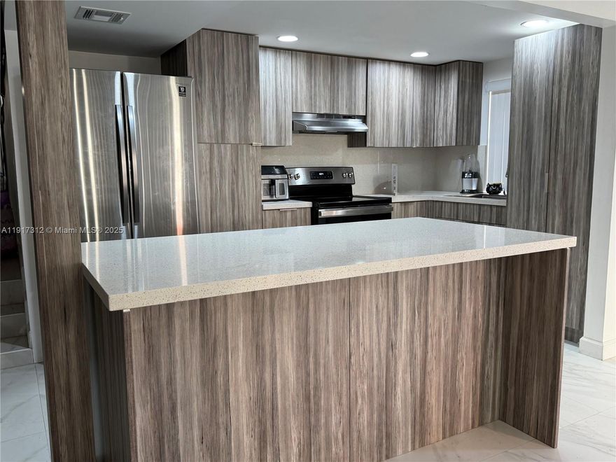 Beautiful, fully updated, 2b/2b First floor, Conner unit condo in the heart of city of Davie.  Offering plenty of room for your family.  Brand new neutral color tile floors leads to your own wrap around open porch/patio to BBQ, relax and enjoy the daily cool breeze.  Features fully updated open layout kitchen giving you an ample space for dining and entertaining. Wood cabinetry, white corks countertops. Extra large family room and dinning for those game nights and family reunion on the upcoming holidays.  Plus breakfast area, a snack bar and a Large center island await you for that perfect meal. Both Bathrooms have been upgraded so all you need is your toothbrush to move in. Washer and Dryer conveniently inside the unit.  Two assigned parking space and NO AGE RESTRICTIONS.  Close to Nova university, shopping center and minutes to I95/595 and the FL TPKE.  A must see….