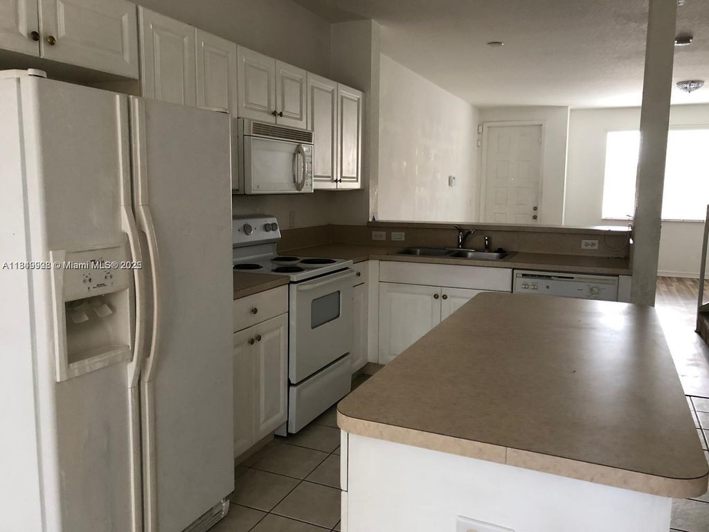 Photo of 1911 Hibiscus Ln, Riviera Beach, FL 33404 (MLS # A11849928)