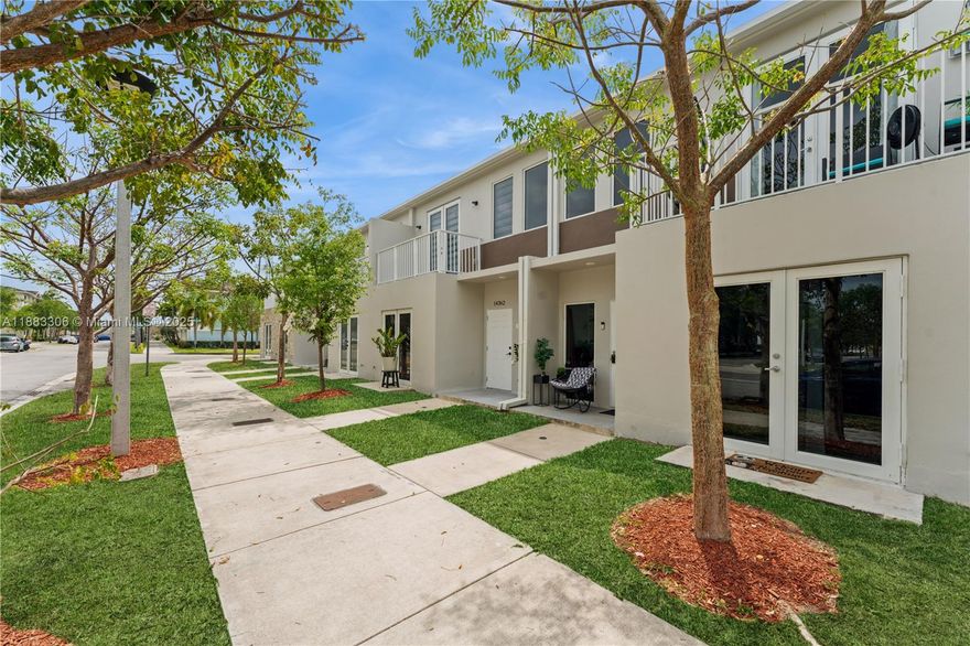 Approximately 1500sq Ft townhome offers 4 bedrooms 3 1/2 bathrooms provides ample living space. The spacious layout feature tile flooring throughout creating a warm and inviting atmosphere. The primary bedrooms are generously sized, offering a peaceful retreat with abundant light. The kitchen is appointed with modern appliances and cabinetry. The bright and airy hallways lead to the property's key highlights including a spacious balcony and peaceful outdoor space. The patio provides ample seating making it ideal for al fresco dining or relaxation. The home's design emphasizes an open and functional flow. Unit has 2 assigned parking with ample spaces for additional cars. Utility shed is NOT included in sale.  Investor Friendly, Can be Air BNB