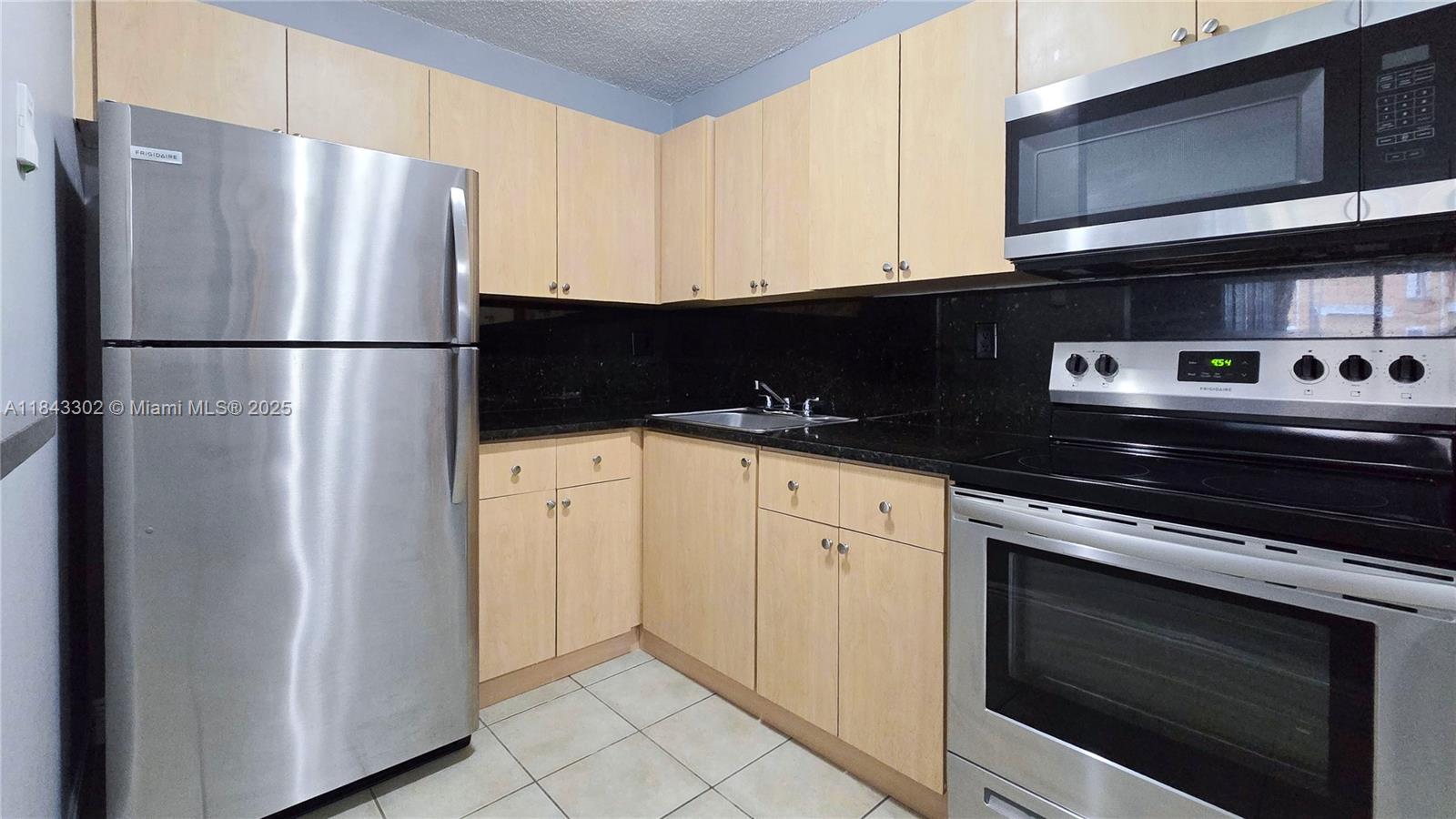 Don't miss the opportunity to live in this stunning apartment! Beautifully renovated and move-in ready, this 2-bedroom, 1-bath unit is located on the first floor of the immaculate Villa Bellini community near the Country Club. It features tile floors, fresh paint, and a modern kitchen with stainless steel appliances. Enjoy the comfort of a new air conditioner, water heater, and in-unit washer and dryer. Ideally situated with easy access to Palmetto, I-75, and the Turnpike. No pets allowed.