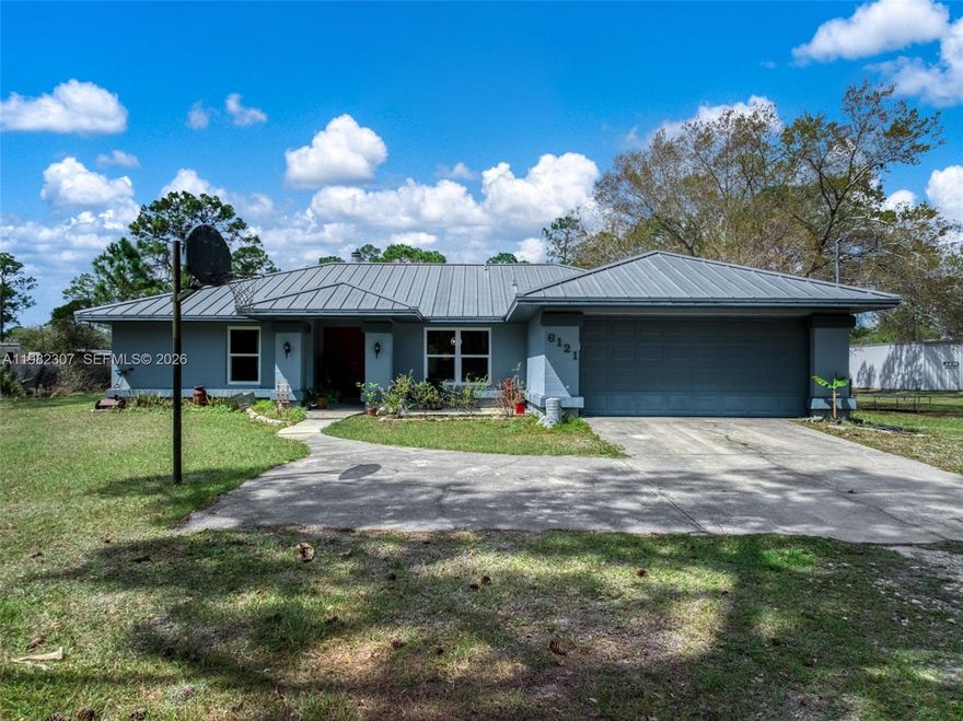 Calling all car collectors,racers,and hobbyists—this one is built for your toys.Located just minutes from the legendary Sebring International Raceway,this unique property has garage space on approximately 2 peaceful acres in Sebring,Florida.The standout feature is the 2,400 sq.ft.(60×40)detached garage/workshop designed w/ enthusiasts in mind.The weight-rated concrete pad is built to handle heavy equipment and performance vehicles,while two car lifts are included for immediate use.The space is fully equipped w/ bright LED lighting,built-in overhead storage,and12-ft×14-ft tall roll-up doors,making it ideal for race trailers,lifted trucks,or a full automotive workshop.Whether you’re restoring classics,maintaining track cars,or simply need room for your collection,this garage delivers.PLUS there is a massive covered and attached open garage space large enough to fit your RV and,again,with a weight-rated concrete pad.Sebring is known worldwide as the home of the historic 12 Hours of Sebring,one of North America’s most prestigious endurance races.The 3/2 home offers 1,700 sqft of living space & sits peacefully on acreage.Inside,you’ll find a spacious living room anchored by a real wood-burning fireplace,creating a warm and inviting gathering space.The large primary suite includes a roomy walk-in closet & a private bath featuring a step-in shower & a relaxing soaking tub.Additional highlights include:impact windows Attached 2-car garage Screened back porch overlooking the backyard.