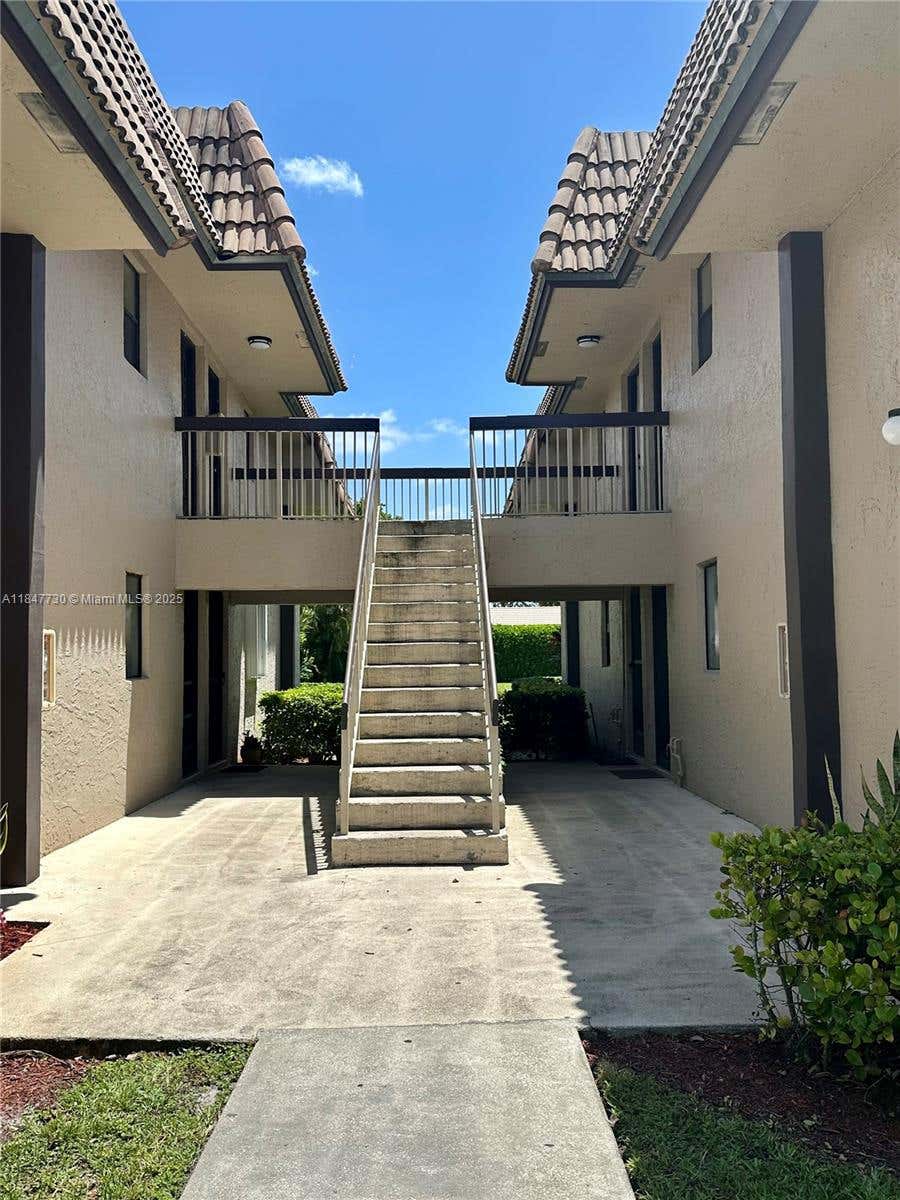Photo of 10722 Royal Palm Blvd #8-2, Coral Springs, FL 33065 (MLS # A11847730)