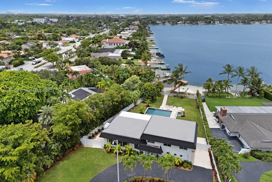 Experience each day with great views of glorious sunrises and sunsets! This peaceful 5 bed 3 bath waterfront property, located on the exclusive LAKE CATALINA, offers a genuine lake lifestyle. This spring fed lake allows for  swimming, motorized boats, jet skis with its own dock & deck. Also Awesome! Bass fishing. Entire home was renovated in 2014 offering large ceramic tiles throughout, gourmet kitchen, Updated plumbing. Roof installed 2014 and high impact windows and doors throughout. More lake view from master bedroom. Spacious master suite with balcony opening to the lake. This property includes Travertine Deck with its own dock, private beach, and boat ramp as well as a brand new 18x36 pool with Spa. Close proximity to major highways, airport, and business districts.