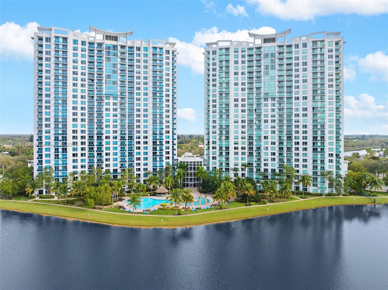Stunning 25th floor condo w unmatched views & full resort amenities. Perched high on the 25th floor, this impeccably maintained condo offers breathtaking panoramic views from 2 balconies. Greet the sunrise over the Ft Lauderdale skyline to the east & unwind w the Everglades sunsets to the west. Inside enjoy refined finishes including marble and wood laminate floors, 3 spacious custom closets & a spa like master bath w a soaking tub, glass enclosed shower, dual sinks & modern lighting. Sleek kitchen w stainless steel appliances (all updated except stove & oven), perfect for both every day living & entertaining. New W/D. Bedrooms w smart ceiling fans, lighting & AC. Unit includes 2 assigned 2nd floor parking and a private storage unit.