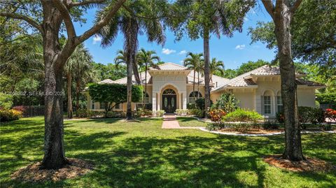 Photo of 12743 N Winners Cir, Davie, FL 33330 (MLS # A12008302)