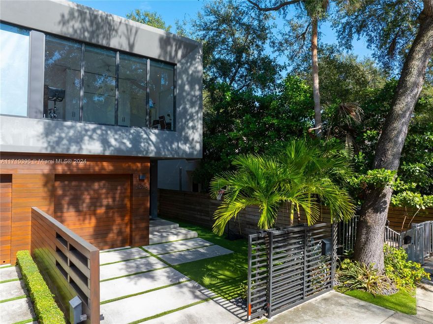 Rarely available newer construction Center Grove townhome with impeccable finishes & spacious design. High ceilings, teak millwork, custom doors & closets, ample storage, large impact windows & abundant natural light throughout. Upstairs boasts an expansive primary suite with oversized closet, motorized shades & spa-like bath, plus two large & bright bedrooms, laundry room & guest bed/office overlooking neighborhood park. Chef’s dream kitchen with Wolf-Subzero appliances. Propane tank run to kitchen range & grill. Generous dining & living rooms. Bonus playroom. Heated pool & covered patio. Four parking spaces! Additional features include built-in speakers, security cameras, smart lighting, authentic wood exterior, motorized gate & tasteful landscaping. Walk to Grove shops and waterfront.