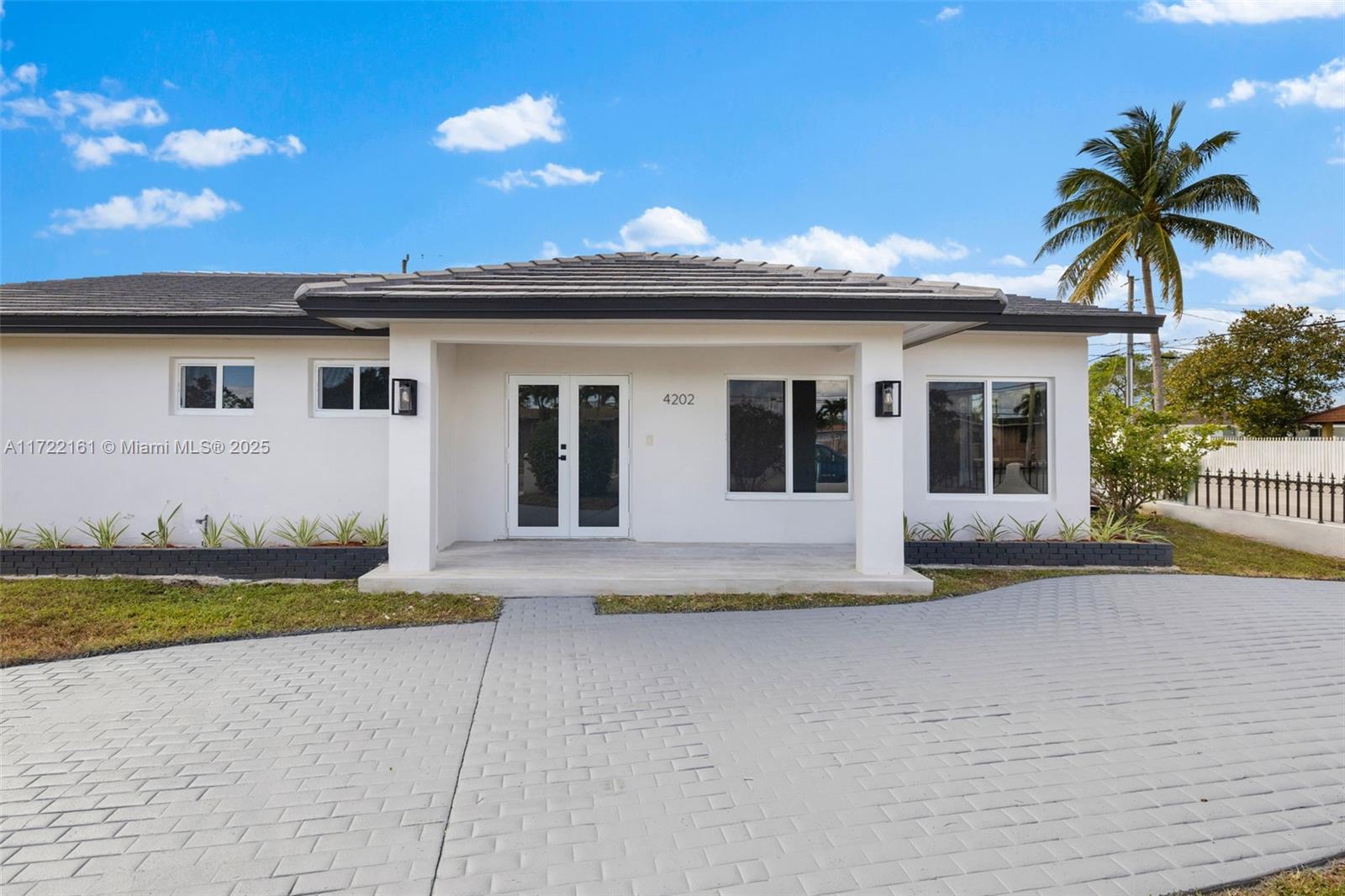 This BEAUTIFULLY remodeled 3-bedroom, 2-bathroom corner home offers modern comfort and style. The main house features a brand-new kitchen with sleek quartz countertops and stainless steel appliances, complemented by new floors throughout. With impact windows and a new roof, this home ensures both safety and energy efficiency. At the back of the property, you’ll find a fully detached mother-in-law suite or playroom, complete with its own bedroom and bathroom, providing extra space and versatility. Perfect for families or guests, this move-in-ready home is designed with thoughtful upgrades to meet your every need.