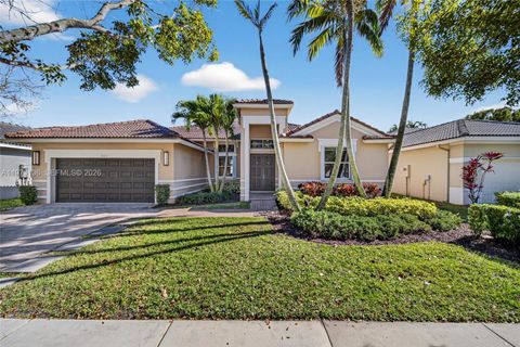 Photo of 1623 Blue Jay Cir, Weston, FL 33327 (MLS # A11973136)