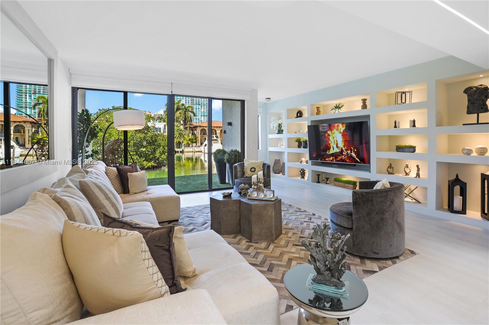 Probably one of the most astonishing townhouses on Poinciana Island.Waterfront remodeled 3bedr plus Office, 2.5bathr, 1car Garage + large driveway.Unique location close to beach (just across Collins Ave), shopping, restaurants, best schools.Ample windows & patio by waterway. Open kitchen: quartz tops/peninsula/backsplash, new SS appl.Living/Dining area: TVwall unit, light art & vaulted skylight, office overlooking.Top quality finishes: light fixtures, WallPapers, modern bathr, cabinetry, waterproof vinyl flooring, glass handrails,
garage opener w storage racks.Amenities: 4 lighted TennisCourts/2 pools/gym u renovation/1.5mi boardwalk.
Condo roof 2019, Boardwalk 2022. HOA $1,641/mo (incl Internet/Cable/Water).Â
Furnishing&Deco for sale only $54,000
::Recorded video tour available::