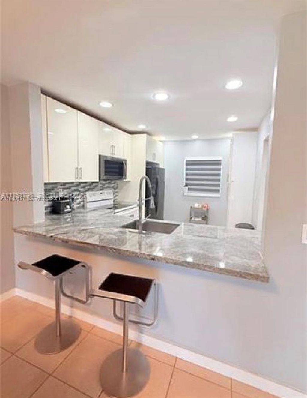 Photo of 8931 N New River Canal Rd #4C, Plantation, FL 33324 (MLS # A11949457)