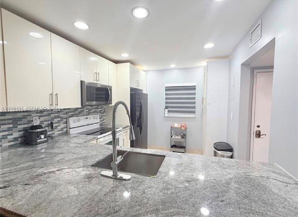 Photo of 8931 N New River Canal Rd #4C, Plantation, FL 33324 (MLS # A11949457)