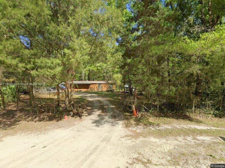Escape to peace and privacy on nearly 3 acres in the quiet Suwannee River Ranchettes community. This 1980 mobile home offers a great opportunity for full-time living, a weekend retreat, or investment. With mature trees and open space, the property provides plenty of room for a garden, animals, or future improvements. Located just minutes from the Suwannee River, public boat ramps, and natural springs, it’s ideal for outdoor enthusiasts who love fishing, boating, and exploring Florida’s nature. Easy access to Old Town and Cross City ensures convenience while still enjoying a rural lifestyle. With no HOA and flexible agricultural zoning, the potential is wide open—bring your ideas and make this property your own!