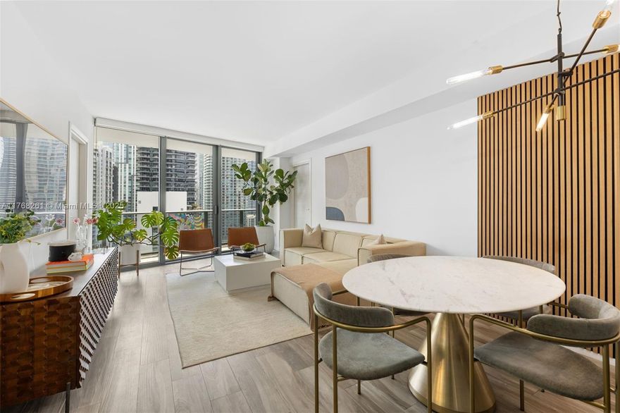 This SLS Lux 2-bed + den, 2.5-bath condo offers breathtaking city views from the oversized balcony, providing ample space for lounging and dining. Inside, enjoy porcelain wood floors, marble bathrooms, and a modern European kitchen with luxury appliances. Custom-built closets and a private elevator foyer add convenience and exclusivity. Located in the heart of Brickell, you're just steps from Brickell City Centre, Mary Brickell Village, dining, and shopping. Residents enjoy five-star amenities, including a state-of-the-art fitness center, pools with BBQ grills, spa facilities, tennis and basketball courts, and a resort-style pool with bar and restaurant service. The building allows 30-day minimum rentals