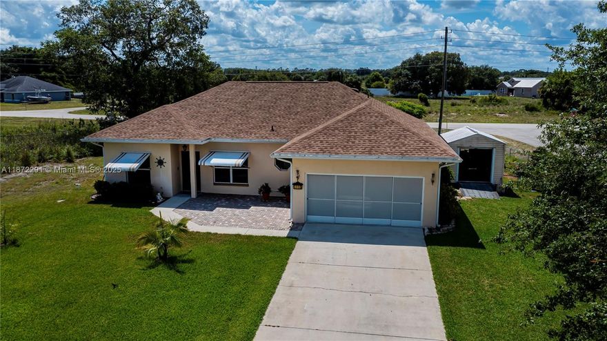 Take a look at this WELL MAINTAINED home located in Port LaBelle. This home sits on an oversized corner lot with beautiful landscaping, trees, and lots of curb appeal. The exterior of the home features concrete block construction, a new roof, a well for irrigation, a sprinkler system, and a storage shed. There are storm shutters on the windows for hurricane protection. The interior of the home features tile flooring throughout the living areas, and vinyl plank flooring in the bedrooms. The kitchen has been recently updated with new cabinets, marble counter tops, back splash, and new appliances. There is also a R.O. System under the sink for added water filtration. Watch the beautiful sunset on the screened lanai. The back yard is fenced for added security for your kids and your pets.