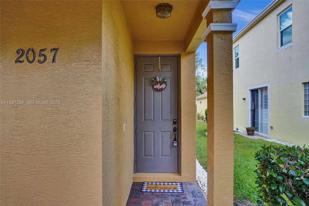 Photo of 2057 SE Avon Park Dr, Port St Lucie, FL 34952 (MLS # A11931254)