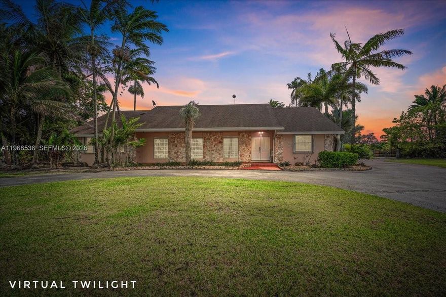 Enjoy Redland living on almost an acre in this 4 bedroom 3 bath pool home on a fenced corner lot just off Krome Ave in Homestead, Florida. A welcoming foyer and formal living and dining spaces create an inviting first impression for gatherings and holidays. The split bedroom layout gives the primary suite privacy from the secondary bedrooms, while updated baths, good closets and an interior laundry room keep daily life comfortable. A large kitchen opens to a spacious family room with a cozy fireplace, then out to a covered patio, sparkling pool, lush landscaping and a walkway to the over-sized detached two car garage, ideal for storage, hobbies or a workshop. The 39,204 square foot lot offers room for pets, play areas, boat or RV parking and future gardens. All in the quiet Redland agricultural area with easy access to Krome Avenue, local farms, fruit stands, parks and Homestead schools, plus a convenient drive to US 1, the Turnpike, Everglades and Biscayne National Parks.