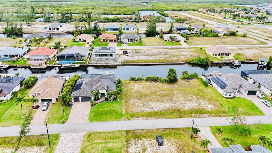 Magnificent gulf access lot, perfectly positioned on Watermelon Canal in the highly desirable part of NW Cape Coral. You'll be captivated by the tranquil views and the peaceful atmosphere. Strategically located just east of Old Burnt Store Rd, this lot places you minutes away from the open Gulf waters. With brand new homes being built this area is highly sought after (house adjacent to this lot sold in 2021 for $1.2M!). The upcoming 7 Islands development elevates this opportunity, promising a host of new amenities including fine dining, shopping, and recreational activities. This addition will not only enhance your lifestyle but also add value to your investment. Build your dream home here (we can recommend builders). Property listing co-listed with Barclay’s Real Estate Group, Cape Coral
