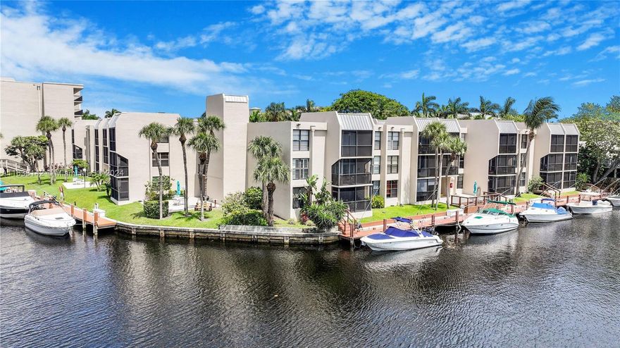 Best condo at Boca Bayou! Rarely available 1st flr corner unit w/direct water view of canal.  New Tile flooring throughout, new window treatment, new A/C unit. Kitchen has granite countertops. Bright & open living area. Master bedroom w/walk-in closet. Community boasts w/ tennis court, five pools, fitness ctr & dock when available. One assigned parking. Bbq grill conveniently located nearby. Water & sewer, Comcast cable w/ HBO channel, Reserve Fund, Property Management, 24 hour manned gated security, & more included in montly maintenance fee. Furniture negotiable.