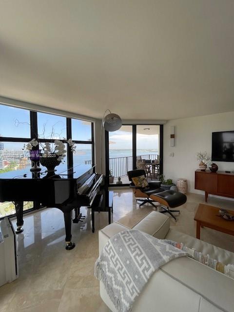 Spacious 2BR/2BA + office fully remodeled corner unit w/ 1661 SF & large balcony. Expansive water views of Key Biscayne. Features hurricane windows & built-out closets, stainless Bosch appl, open concept. Bldg offers marina, 2 pools, gym w/ sauna & steam, 6 tennis courts, pickleball, valet, 24hr security, pkg receiving, club room, onsite mgmt, kids’ playground, BBQ, & café/sundry shop. Includes 1 covered pkg; others avail. Rare lifestyle & views in a full-service building. 1 of lowest condo fees on Brickell.