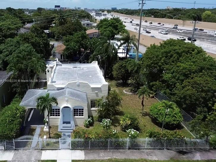 Step into this completely renovated Miami home just minutes from Wynwood and the Design District. Sun-filled living areas blend timeless character—arched openings, original trim—with fresh quartz countertops, stainless appliances, and updated plumbing and electric. A deep, fully fenced yard invites Sunday barbecues, future-pool dreams, or pets that love to run. Need extra space? The detached studio/ADU is ready for guests, office, or creative pursuits, and the covered carport keeps you dry on rainy days. Quiet street, no HOA, and quick access to Brightline & I-95. Located in a federally designated Opportunity Zone—ask how this could boost long-term returns. Call the listing agent for full details and a private tour!