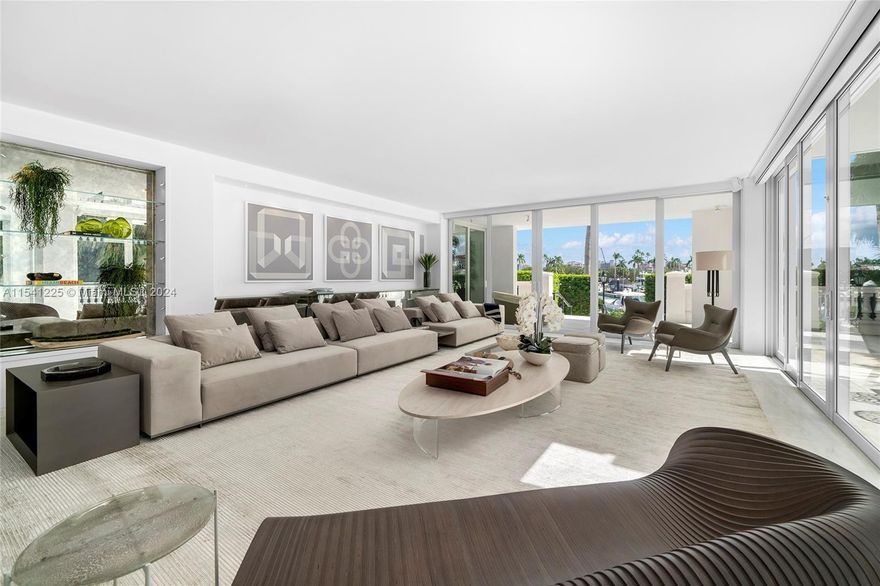 This spectacular one-of-a-kind 2-story townhouse is located in Harborview overlooking Fisher Island’s inner marina. Home features 4BR/4+1BA & over 6,000 SF of living area, marble & rich hardwood floors, glass doors, ceiling/wall accents. 1st floor offers a spacious living & dining layout, access to an expansive wraparound terrace w/direct marina views, sleek chef’s kitchen, sumptuous principal suite & luxurious spa-inspired bathroom. 2nd floor features a large open floor plan, family room w/home theater, soaring vaulted ceiling & dining terrace overlooking the marina. Gym area, dining space, kitchen, plus 3BR/3BA upstairs. Amazing location-access to path near all the best Fisher amenities. Garage parking - 4 cars & 4 golf carts. 72’ boat slip right behind unit can be acquired separately.