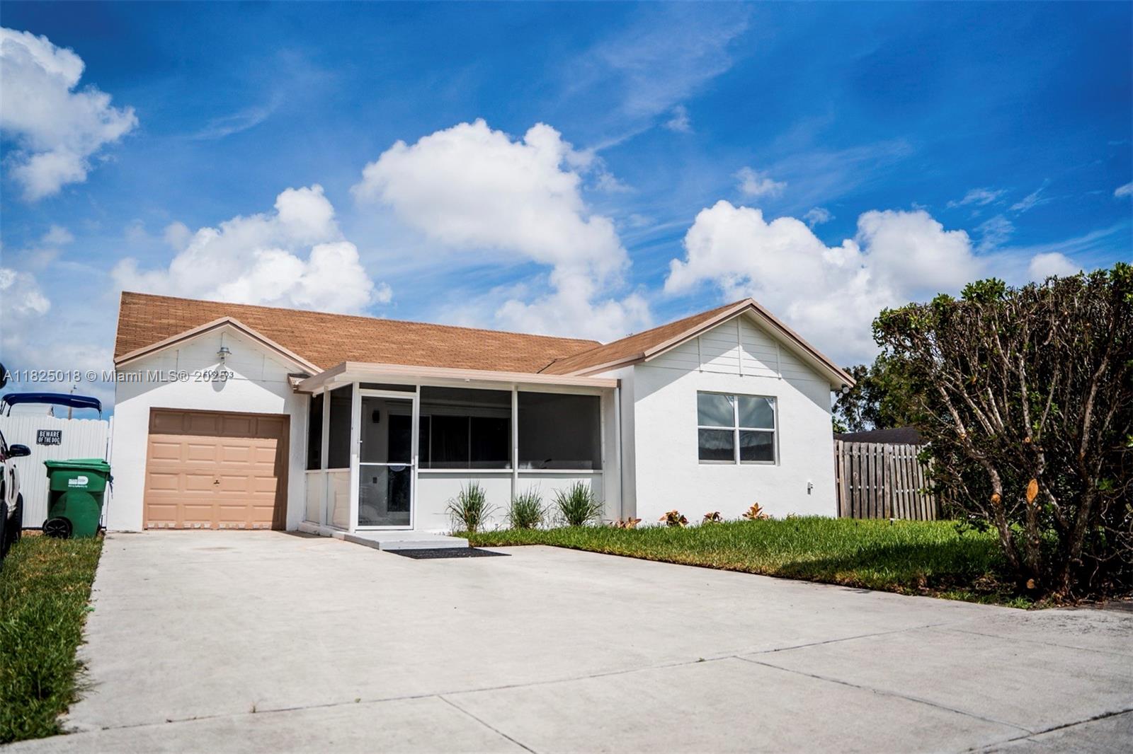 Beautifully renovated 3BD/2BA + den single family home with no HOA! Perfect for families, pets, or Airbnb investors. Just minutes from Hard Rock Stadium, 20 minutes for the beaches, and close to Aventura Mall for shopping. Enjoy true ownership freedom! This move-in-ready home features a modern open-concept design, hurricane impact windows, updated central A/C, and brand-new waterproof laminate flooring. Enjoy LED recessed lighting, fresh interior/exterior paint, and ceiling fans in every room. Bathrooms include one with a walk-in shower and one with a tub. The versatile den/office space is ideal for remote work. New plumbing fixtures, security-coded entry, camera system capability, screened-in front patio, private driveway, and fenced backyard.