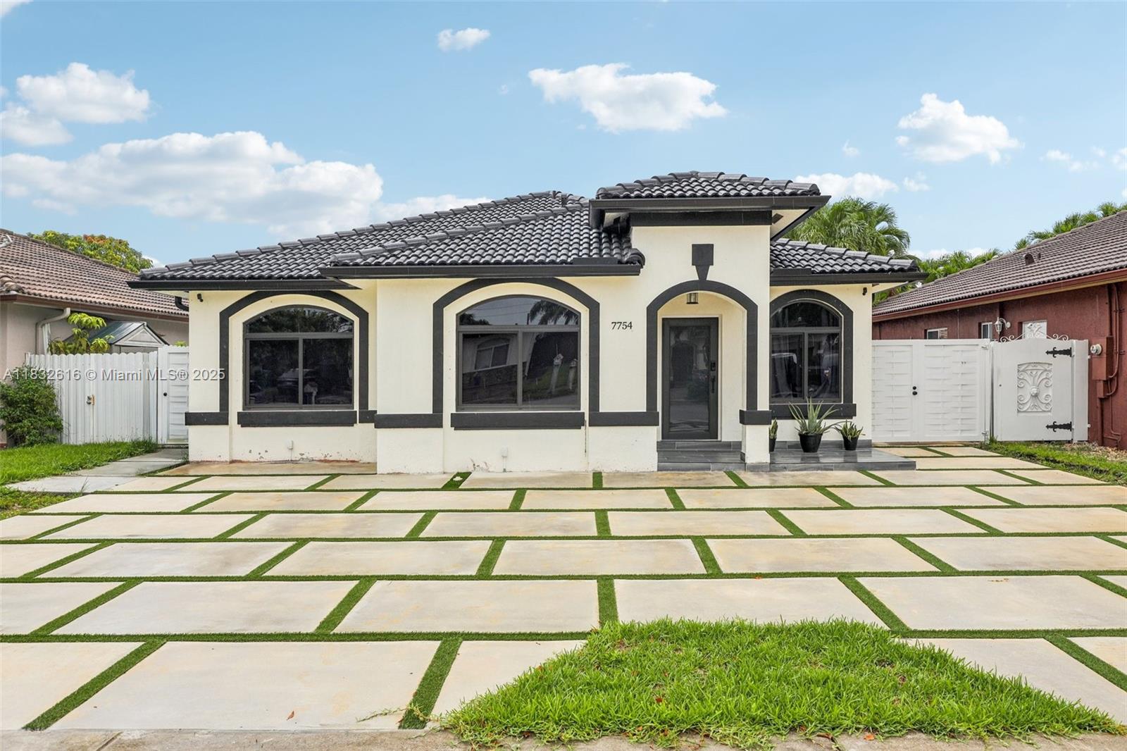 **NO HOA!** This completely renovated 3-bedroom, 2-bathroom home features an open floor plan with vaulted ceilings and modern finishes. The sleek new **cement driveway**, leveled grass, and **stylish metal fence** add incredible curb appeal. Inside, enjoy a new granite kitchen with an oversized island and stunning 90-degree waterfall edges, stainless steel appliances, and new central A/C. The home boasts new porcelain tile floors, modern baseboards, and custom bathrooms with glass barn doors and LED mirrors. Additional highlights include a spacious master suite with a walk-in closet, dual sinks, and an oversized tub, along with a full laundry room, recessed lighting, and fresh interior and exterior paint. The fenced backyard offers plenty of space for a pool. Co Listed with Zillow Inc.