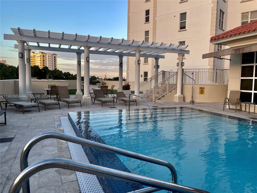 Elegant unit in Minorca, marble floors, updated appliances, state of the art Master closet, walking distance to Miracle Mile
