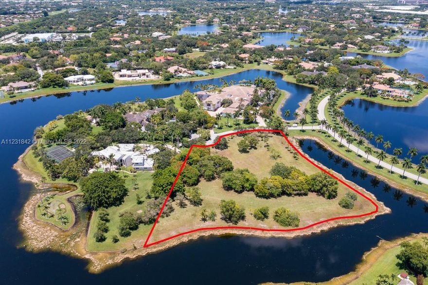 A True Trophy Property! Spectacular 3.76 acre residential lot in Windmill Ranch Estates, one of the most exclusive luxury enclaves in West Broward, and all of Southeast Florida. This over-sized vacant lot represents a VERY RARE opportunity to own such an expansive tract of land within the most coveted gated community in Weston,  one of the most desirable and accessible cities in the region. The lot is provided with a favorable southern orientation and an impressive 750 feet of lake frontage. Plans for a stunning 15k SF med estate by InSite Design Group are readily available, and LANDMARK CUSTOM HOMES OF BROWARD is ready to consult and assist and expedite planning, budgeting and construction of your dream estate home.