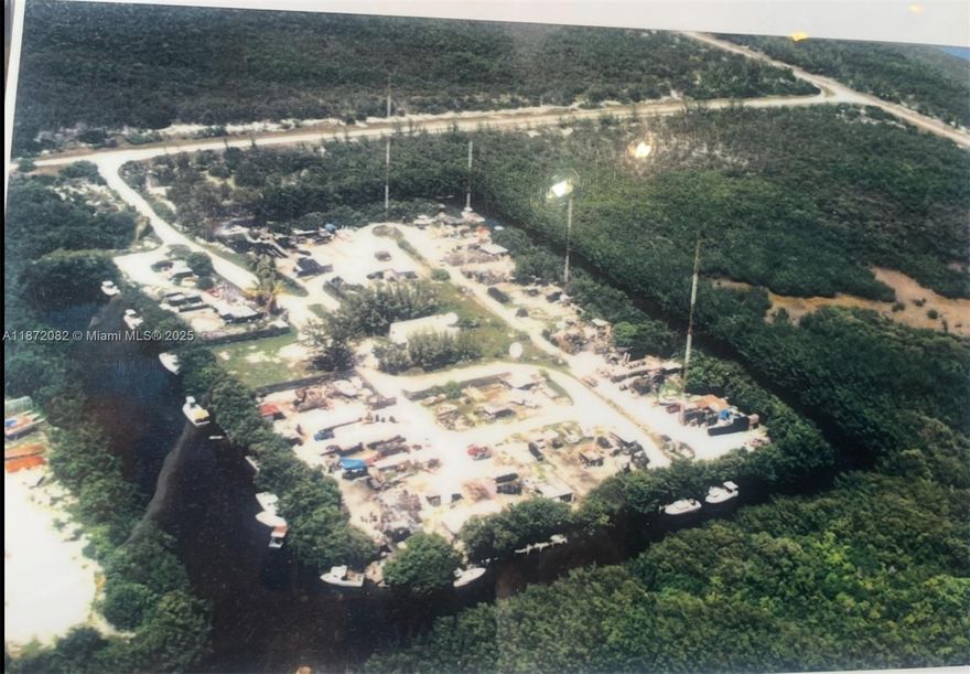 This rare 9-acre waterfront parcel is located on secluded Boot Key, a largely undeveloped island within the city limits of Marathon in the heart of the Florida Keys. Accessible only by boat since the drawbridge connection to Vaca Key was removed in 2010, the property offers privacy, natural beauty, and exceptional potential. Zoned mixed use, it includes 25 existing docks, a building and radio towers from a former local radio station, and portions of the land currently leased to fishermen. There are no active utilities on site, making it a true blank canvas for future development or a private retreat. With motivated ownership and flexible possibilities, this is a unique opportunity to secure a piece of the Florida Keys.