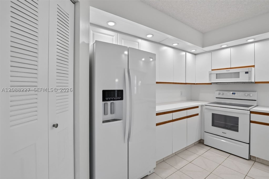 Photo of 1200 SW 125th Ave #212L, Pembroke Pines, FL 33027 (MLS # A12088227)