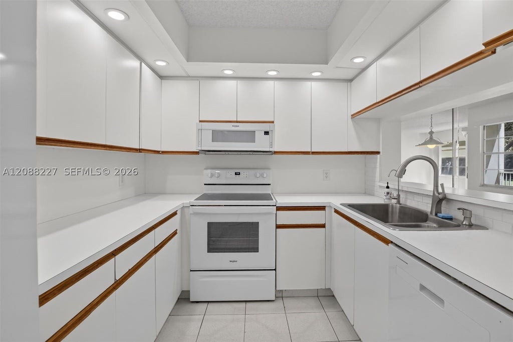 Photo of 1200 SW 125th Ave #212L, Pembroke Pines, FL 33027 (MLS # A12088227)