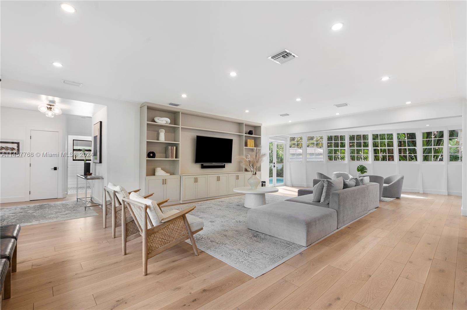 Indulge in the calming coastal ambiance of this meticulously fully renovated mid-century pool home in the most desirable Morningside location. Attention to quality is evident from the moment you enter. Clean lines, abundant natural light and open spaces create a tranquil atmosphere. Every detail has been carefully considered, from designer baths and oak floors to custom cabinetry. The skylit chef’s kitchen features Thermador appliances & sleek quartz countertops. The garage has ample space for storage, making this home a total of 2,777 SF. Large lot with mature shade trees and heated saltwater pool. Stroll to Morningside Park. Easy access to Design District, restaurants, shopping, yoga & fitness studios and Miami's top schools. Just 15 minutes from South Beach, Brickell, and the airport.