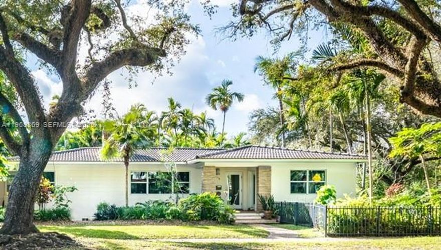 Charming 4BD/3BA residence in the heart of Miami Shores! This light-filled home blends classic character with thoughtful modern updates, featuring beautiful original hard wood floors and Cuban tile, fireplace, indoor & outdoor grill, and wide, open living spaces ideal for entertaining. The updated kitchen flows seamlessly into a spacious living area filled with natural light. 

Step outside to a lush, tropical garden offering privacy and room to relax. Additional highlights include impact windows, a two-car carport plus garage, and generous parking.

Ideally located on a picturesque oak-lined street within walking distance to local restaurants, the Miami Shores Community Center with tennis and pickleball courts, soccer fields, shops, and the Miami Shores Golf Course. A rare opportunity to own a warm, inviting home in one of Miami Shores’ most desirable neighborhoods.

Notes: Location is elevated (not in flood zone). The fourth bedroom/office with en-suite bathroom has started construction, offering the opportunity to design and finish it to your own taste and vision.