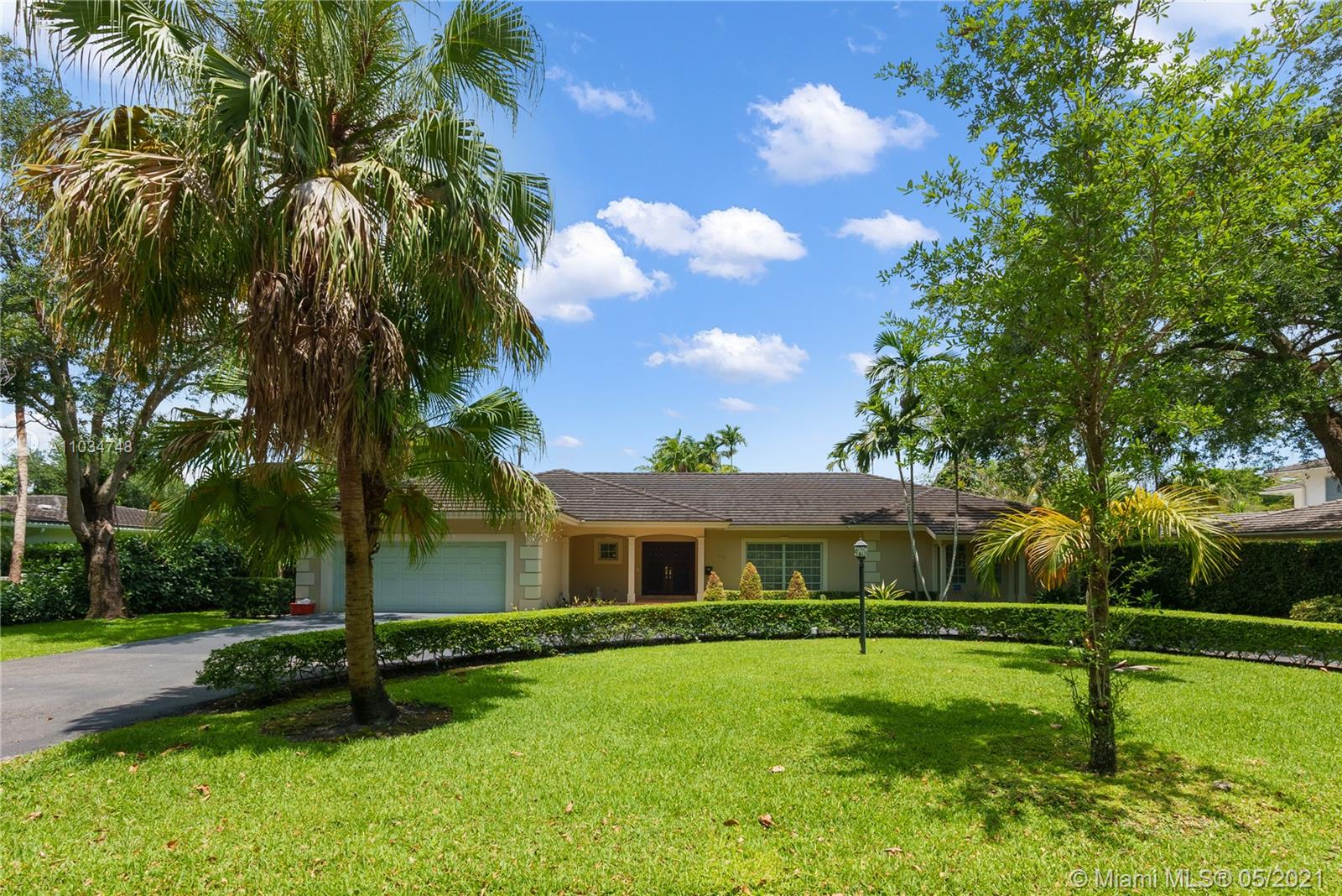 Perfect for a large family, spacious one-story home with split plan and pool on a quiet charming street. Large 5 bedrooms, 4 full baths, formal living and dining rooms. 2 car garage, circular driveway, and covered lanai overlooking pool.  Great location and within walking distance to Biltmore Hotel.  Close to shopping, restaurants, parks and much more.  Lots of potential to make it your own with many possibilities!