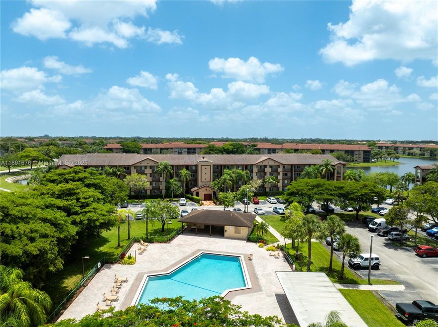 55+ COMMUNITY – Nestled perfectly between a tranquil lake and the nearby satellite pool, this 2-bedroom, 2-bathroom Primrose model offers a breathtaking southern exposure view. The unit features a cozy breakfast nook and a galley-style kitchen, along with like-new carpet flooring throughout. Convenience abounds with a washer and dryer inside the unit and a large walk-in closet in the master bedroom. Rent includes: cable, internet, water, and full access to all community amenities — including free transportation, live theater shows, movie screenings, card rooms, heated pools, tennis courts, pickleball courts, and fitness center. Ideally located within walking distance to the main entrance, pickleball courts, and Club Health gym, this building was recently repainted inside and out.