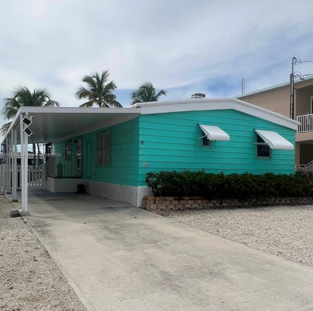 Another great opportunity to experience living in "Paradise" in the fabulous Florida Keys. Beautiful double wide manufactured home canal front with direct ocean access in the wonderful community of Wynken, Blynken & Nod - 2 bedrooms & 2 baths, modern kitchen, dinning and living areas with full washer and dryer inside the home. Property is in moving condition for you to start enjoying the keys lifestyle right away and out to the ocean is 2 minutes to enjoy Rodriguez Key and surrounding popular sandbars. Easy to Show...contact Listing Agent or use ShowingAssist for appointments and instructions.