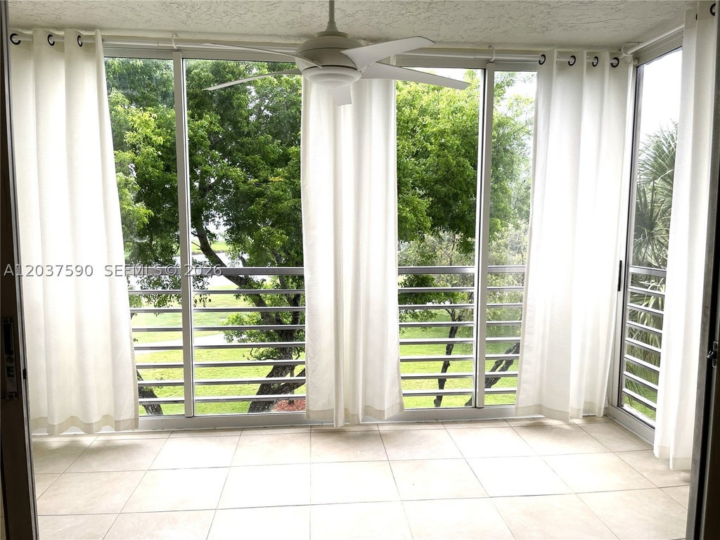 Photo of 9531 Seagrape Dr #305, Davie, FL 33324 (MLS # A12037590)