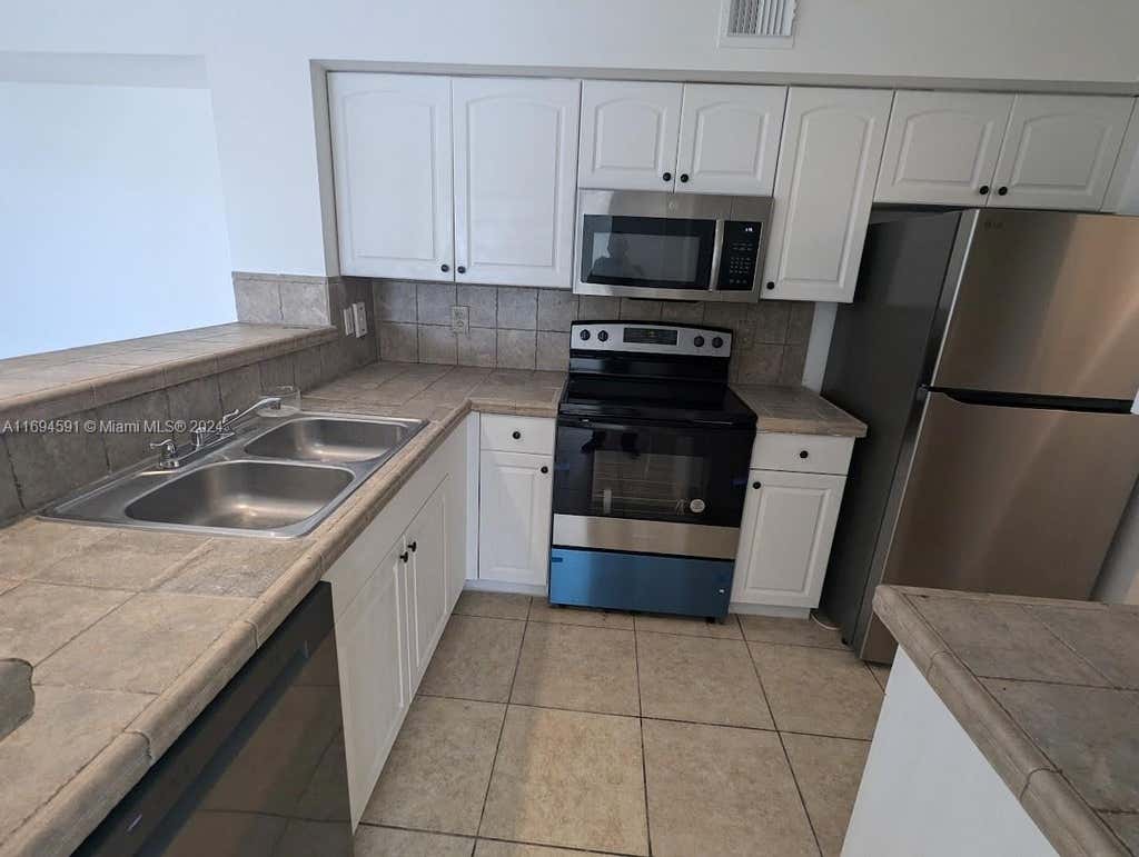 Photo of 1715 Village Blvd #208, West Palm Beach, FL 33409 (MLS # A11694591)