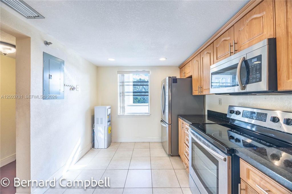 Photo of 3940 Inverrary Blvd #403-A, Lauderhill, FL 33319 (MLS # A12003781)